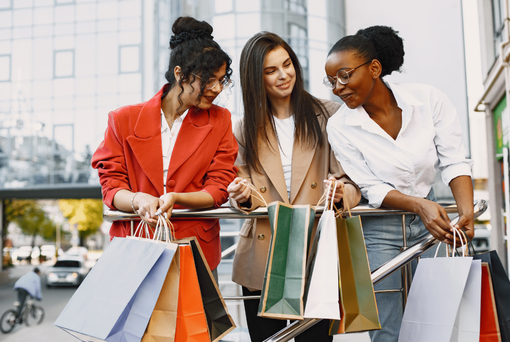 Shoppers at the mall holding shopping bags