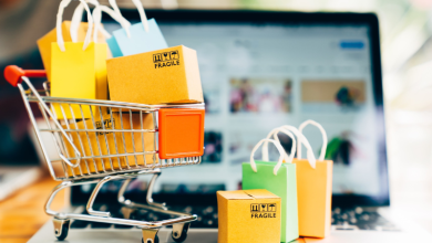Shopping cart filled with items next to computer. Showing relationship between AI and shopping