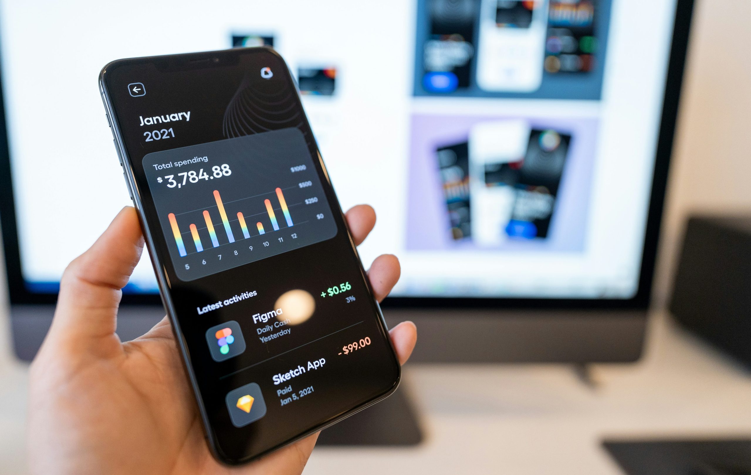 Phone displaying a personal spending app with latest activities using ai for credit analysis.
