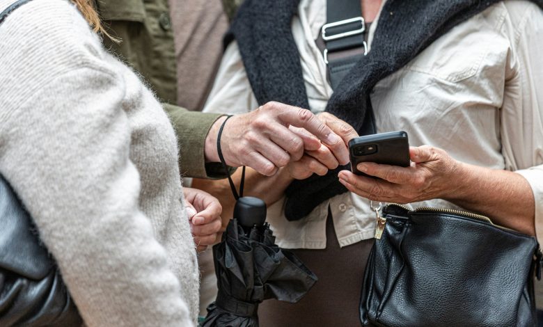 Travelers using AI on their device to help with the travel route and plans